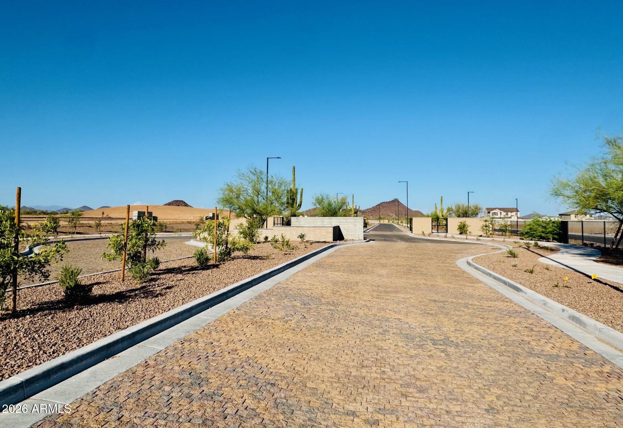 16206 West Red Bird Road Surprise, AZ 85387 - Photo 32 of 35 a view of a terrace with a bench