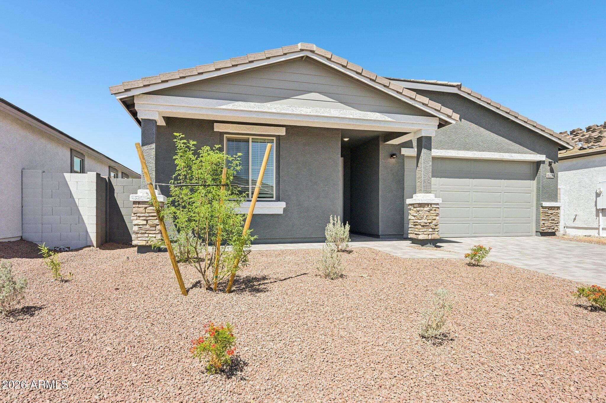 16206 West Red Bird Road Surprise, AZ 85387 - Photo 4 of 35 a front view of a house