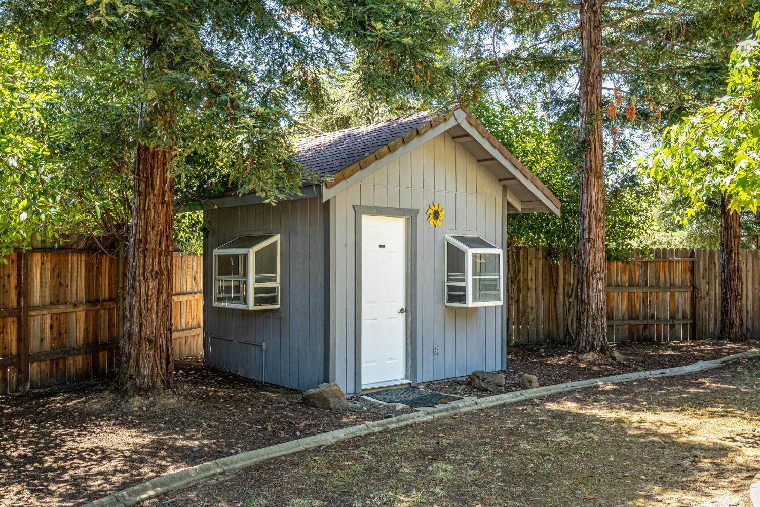 9282 Dever Circle Elk Grove, CA 95624 - Photo 37 of 38 "WEE HOOSE" SHED IS FINISHED ON THE INTERIOR. IT HAS FUNCTIONED AS ADDITIONAL STORAGE AND PLAYHOUSE.