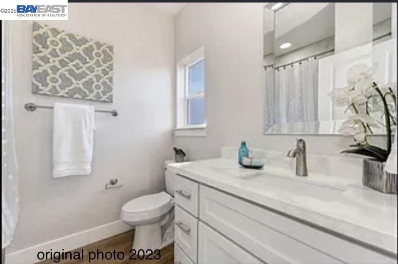 3334 Rio Linda Boulevard Sacramento, CA 95838 - Photo 12 of 31 a bathroom with a sink toilet and mirror