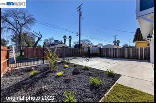 a view of a backyard with furniture