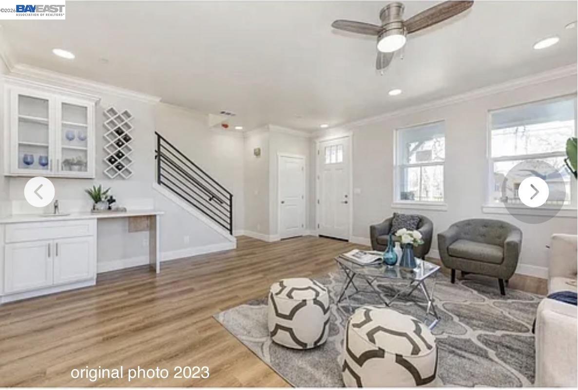 3334 Rio Linda Boulevard Sacramento, CA 95838 - Photo 2 of 31 a living room with furniture a dining table and wooden floor