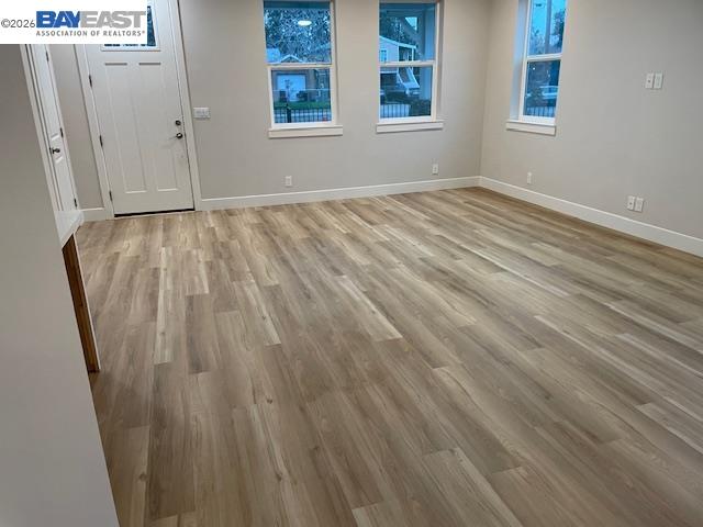 3334 Rio Linda Boulevard Sacramento, CA 95838 - Photo 23 of 31 a view of an empty room with wooden floor and a window