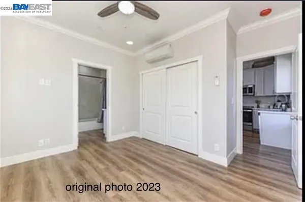 a view of a room with wooden floor