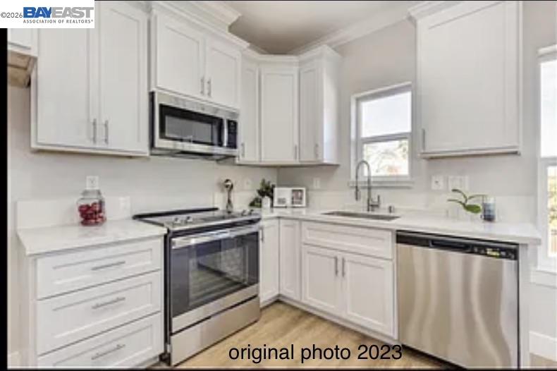 3334 Rio Linda Boulevard Sacramento, CA 95838 - Photo 30 of 31 a kitchen with stainless steel appliances granite countertop a sink a stove and cabinets