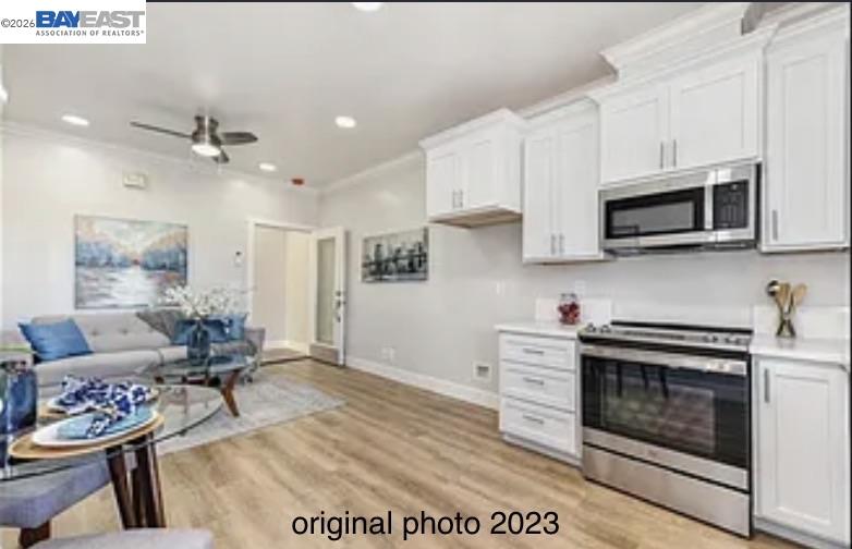 3334 Rio Linda Boulevard Sacramento, CA 95838 - Photo 31 of 31 a kitchen with stainless steel appliances kitchen island granite countertop a stove a sink and a microwave