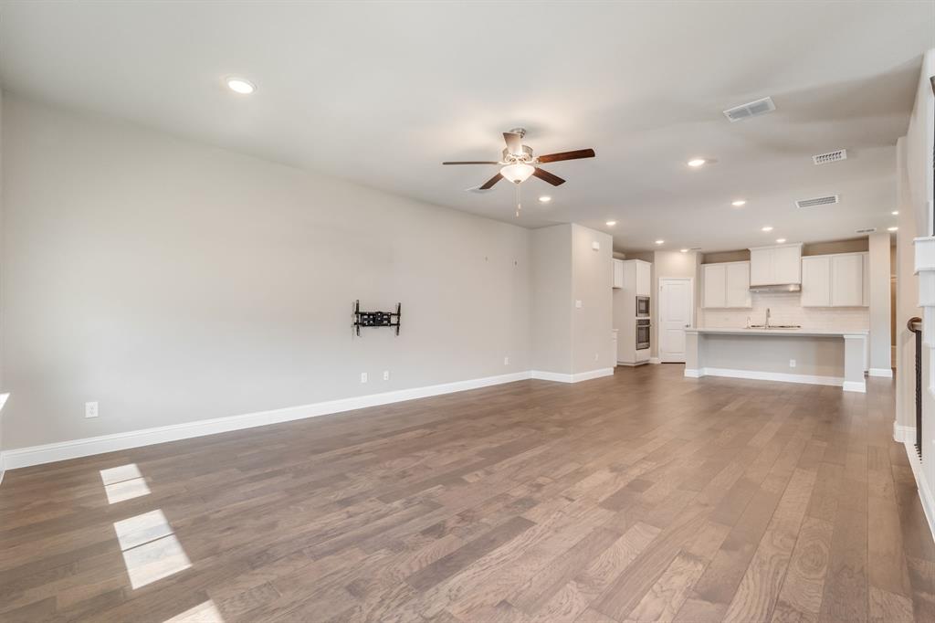 801 Cassandra Court Euless, TX 76040 - Photo 16 of 36 a view of an empty room with a kitchen