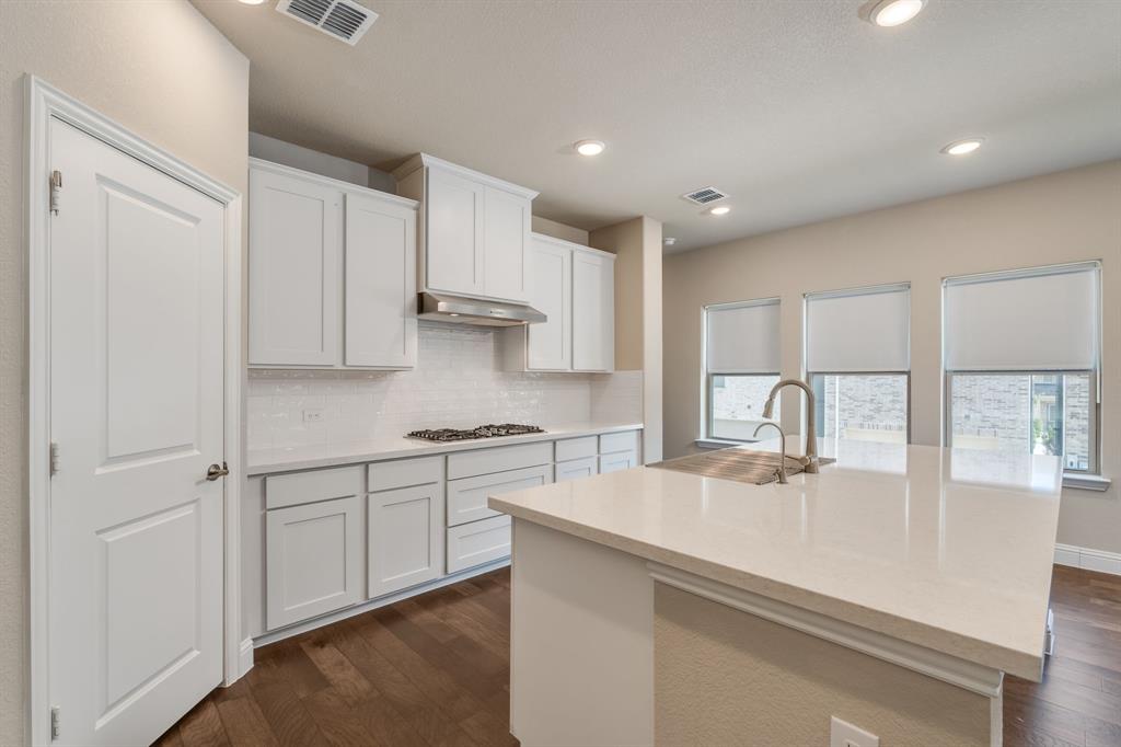 801 Cassandra Court Euless, TX 76040 - Photo 20 of 36 a kitchen with stainless steel appliances granite countertop a sink a stove and a refrigerator