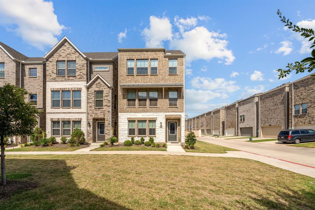 801 Cassandra Court Euless, TX 76040 - Photo 2 of 36 a front view of a building with a garden and fountain