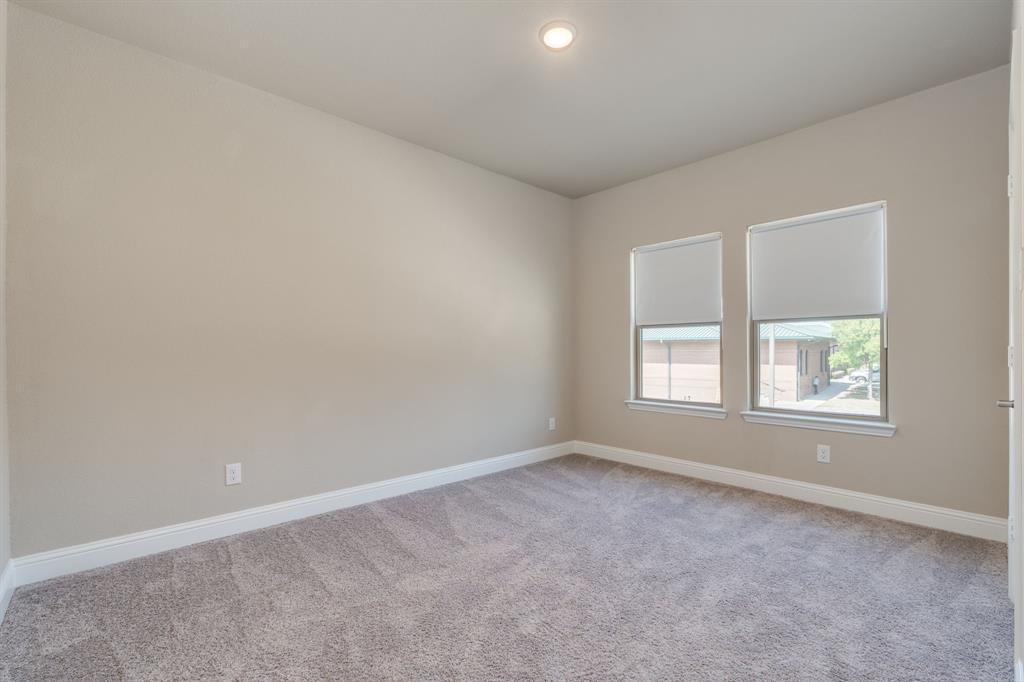 801 Cassandra Court Euless, TX 76040 - Photo 24 of 36 an empty room with windows