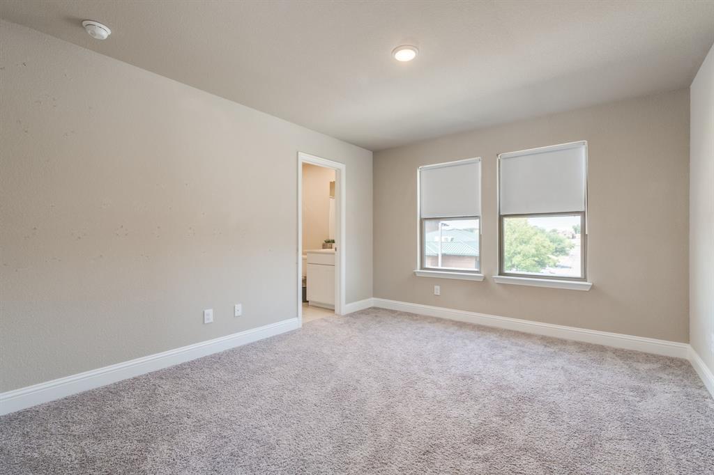 801 Cassandra Court Euless, TX 76040 - Photo 34 of 36 an empty room with windows