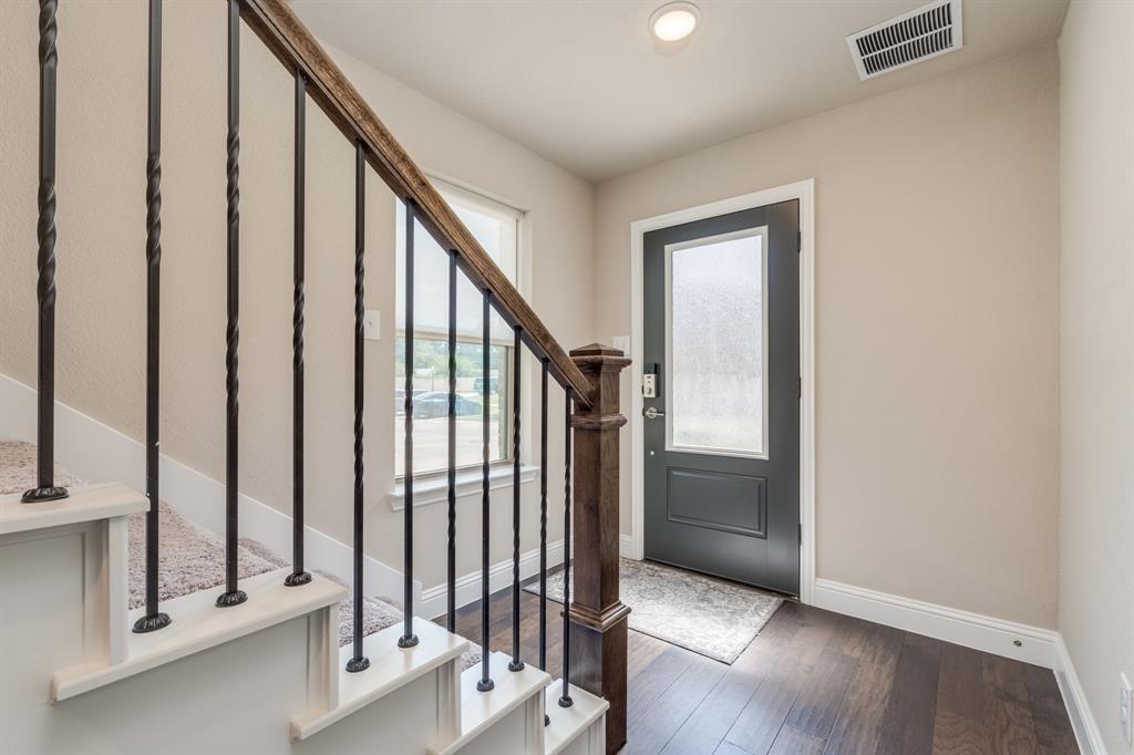 801 Cassandra Court Euless, TX 76040 - Photo 4 of 36 a view of an entryway with staircase