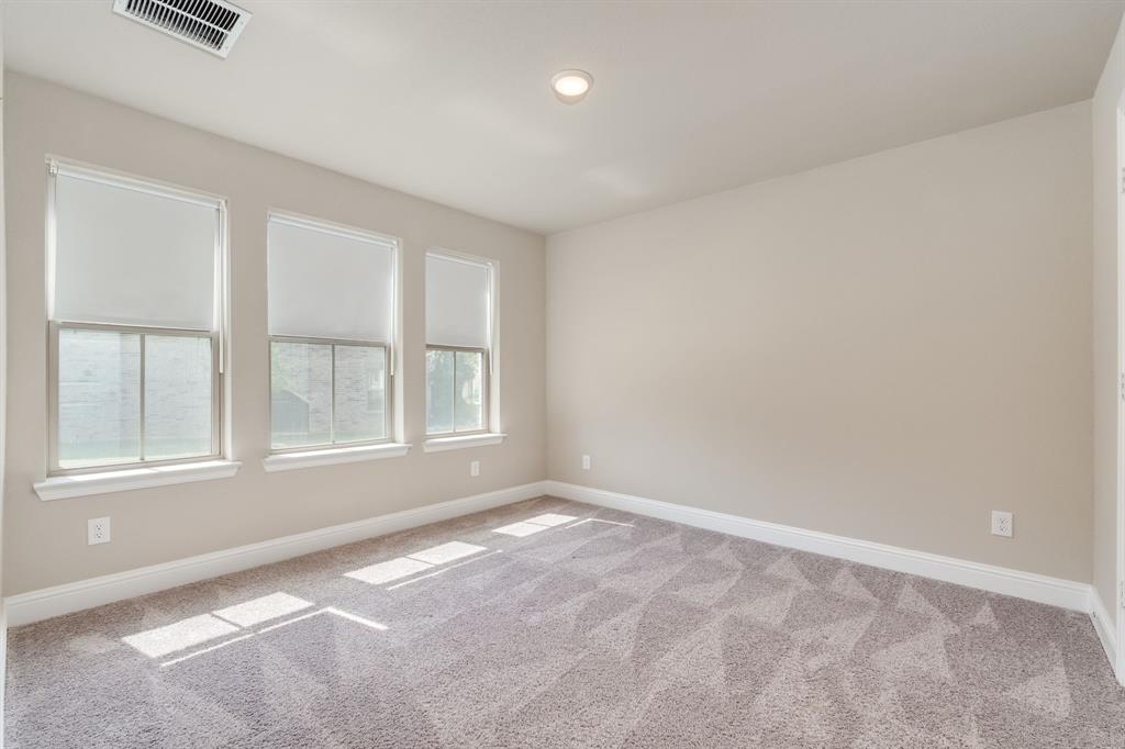 801 Cassandra Court Euless, TX 76040 - Photo 5 of 36 an empty room with windows