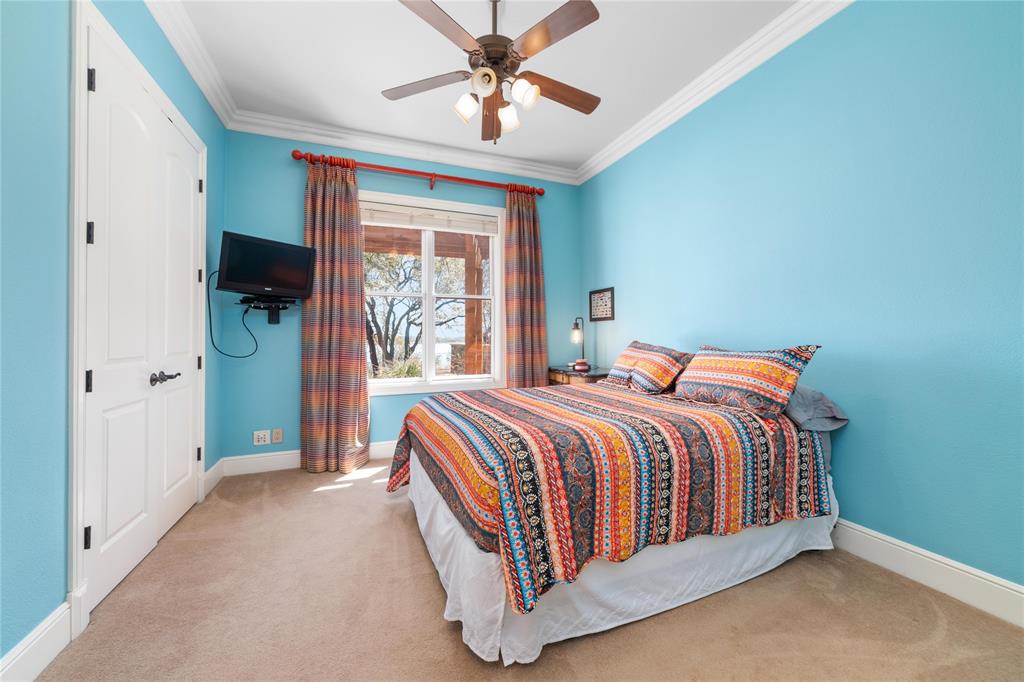 600 Oak Point Drive May, TX 76857 - Photo 33 of 35 a bed sitting in a bedroom next to a window