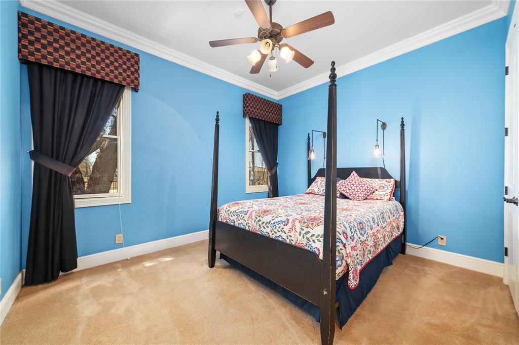 600 Oak Point Drive May, TX 76857 - Photo 34 of 35 a bedroom with a bed chandelier and a window