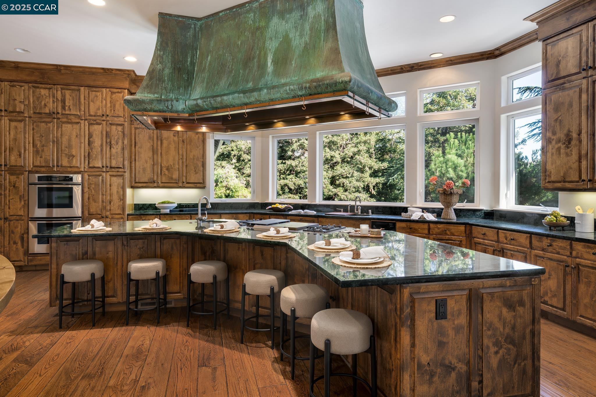 471 El Rio Danville, CA 94526 - Photo 16 of 51 a dining table with chairs and window