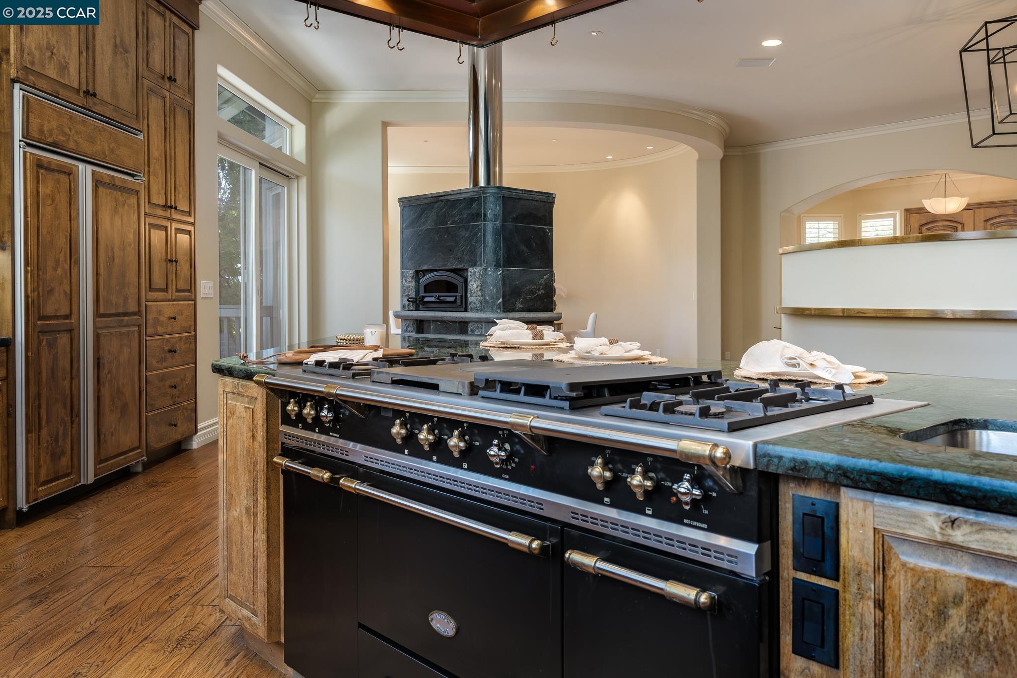 471 El Rio Danville, CA 94526 - Photo 19 of 51 a kitchen with a stove and a wooden floor