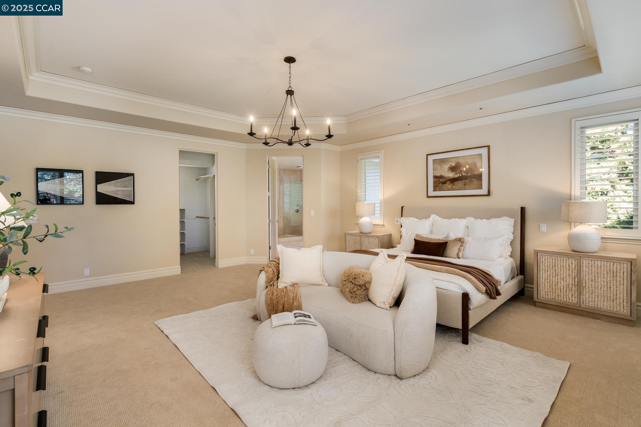 471 El Rio Danville, CA 94526 - Photo 21 of 51 a spacious bedroom with a bed and a chandelier