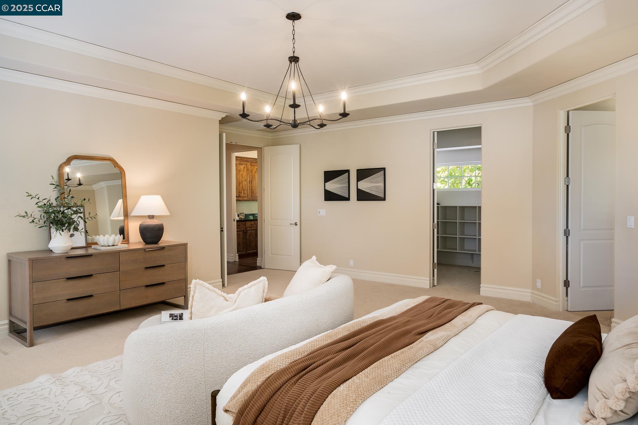 471 El Rio Danville, CA 94526 - Photo 22 of 51 a bedroom with a bed chandelier and dresser