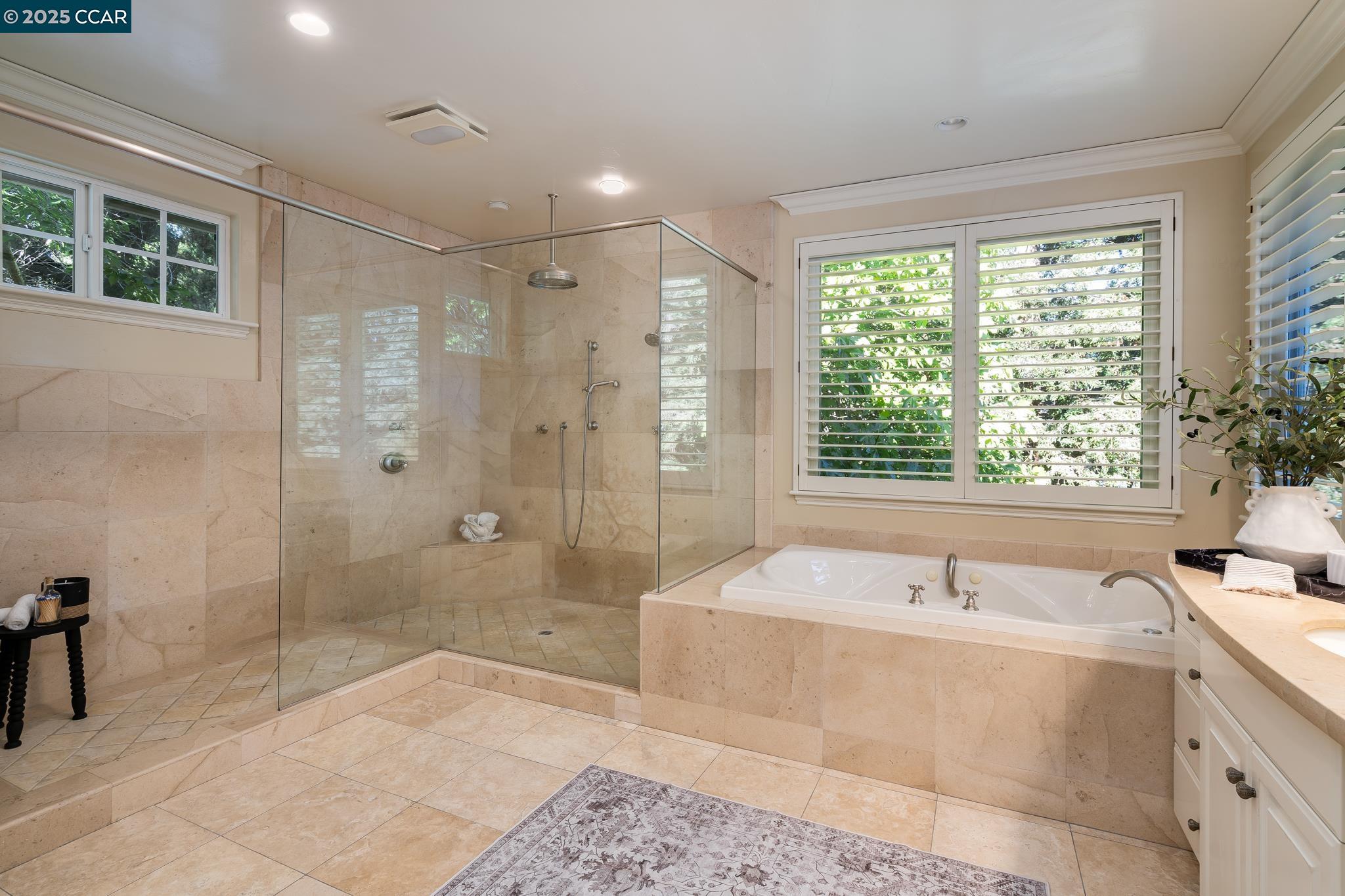 471 El Rio Danville, CA 94526 - Photo 25 of 51 a spacious bathroom with a tub shower sink and mirror