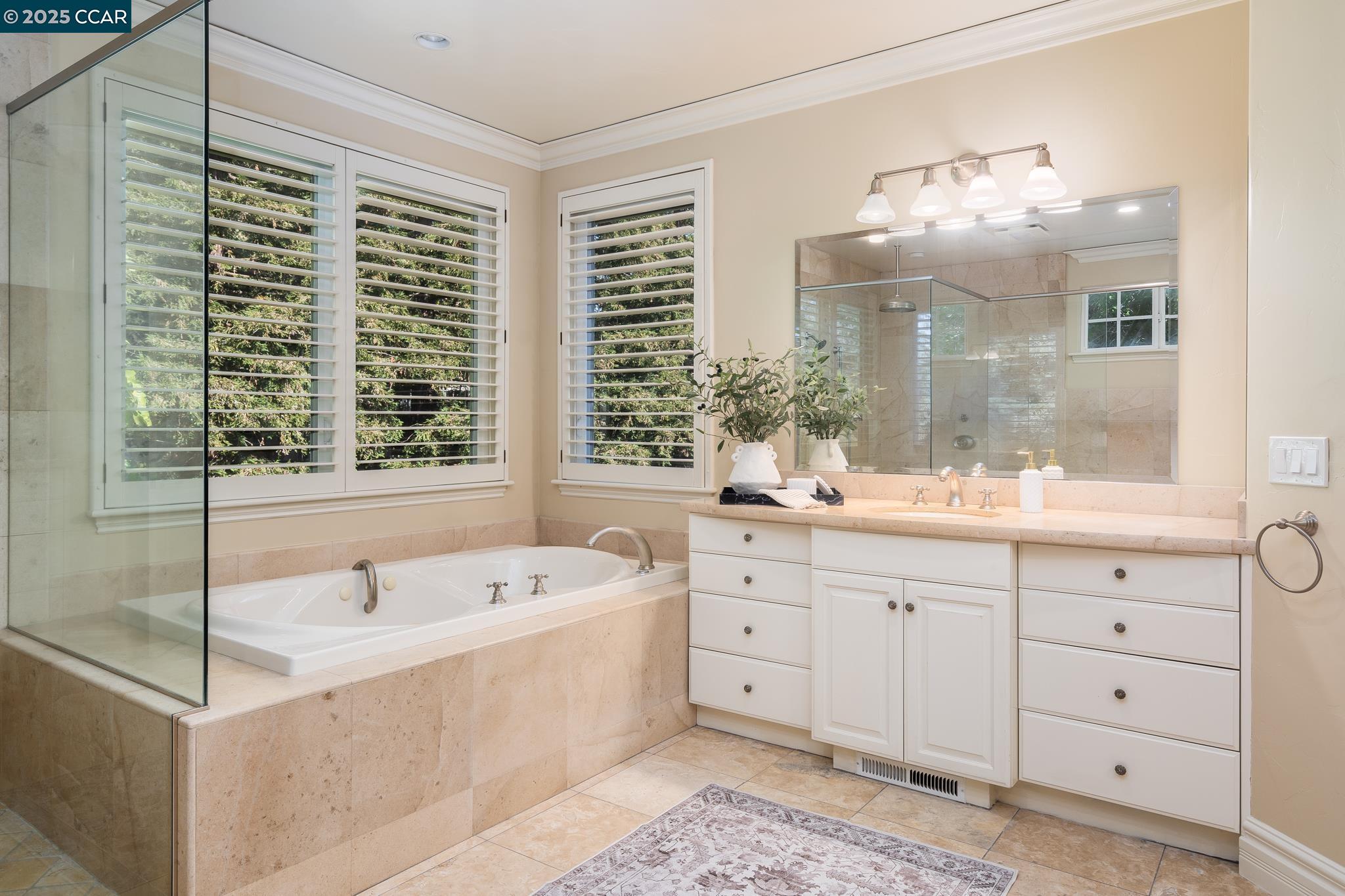 471 El Rio Danville, CA 94526 - Photo 26 of 51 a spacious bathroom with double vanity a sink a large mirror and a bathtub