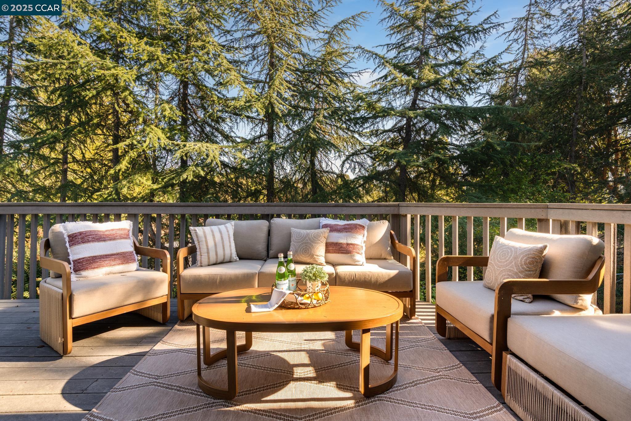 471 El Rio Danville, CA 94526 - Photo 37 of 51 a balcony with wooden floor and outdoor seating