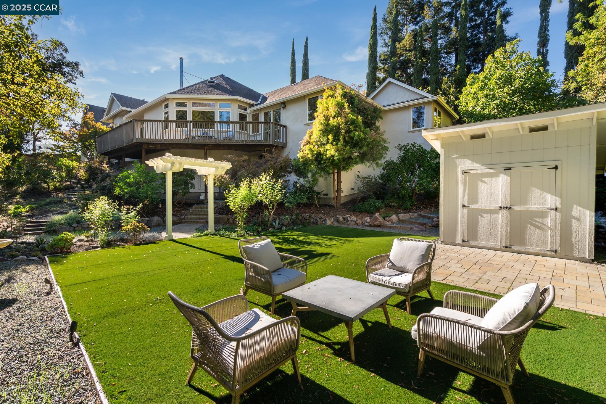 471 El Rio Danville, CA 94526 - Photo 46 of 51 a view of a patio with couches chairs and a big yard