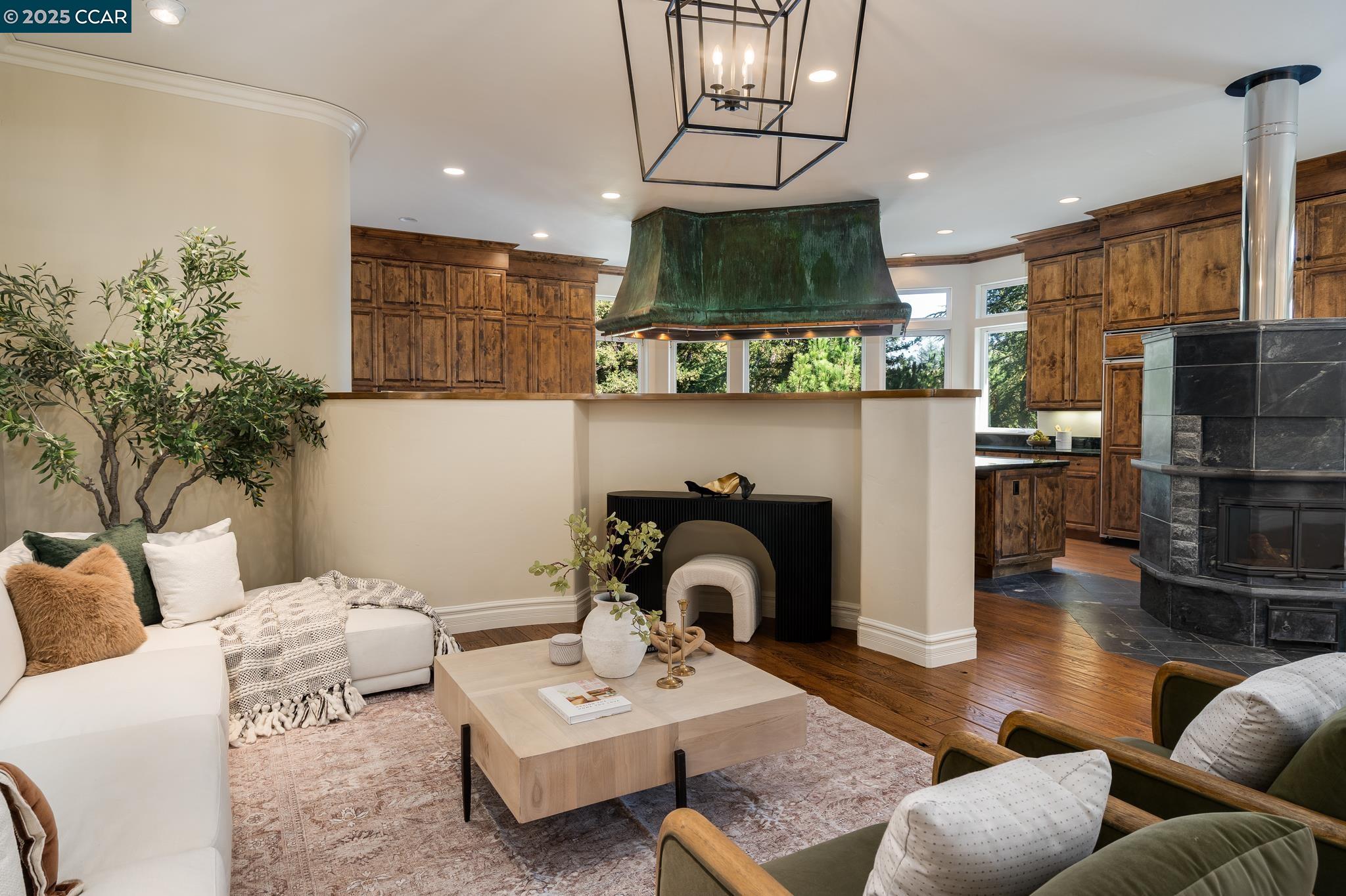 471 El Rio Danville, CA 94526 - Photo 7 of 51 a living room with furniture a fireplace a flat screen tv and kitchen view
