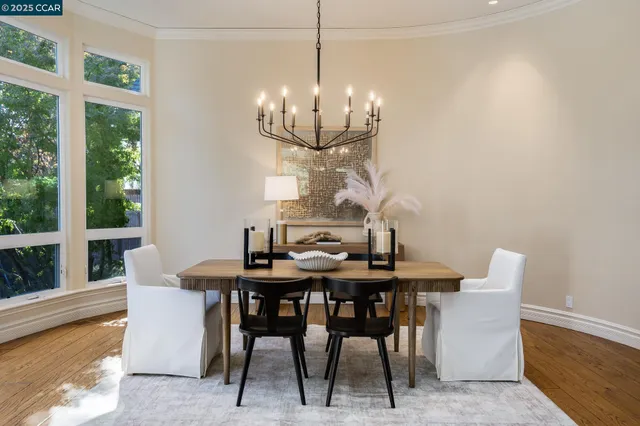 a view of a dining room with furniture window and outside view