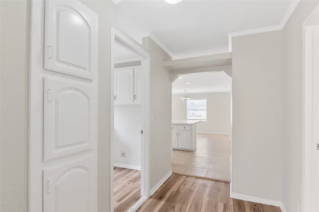 a view of hallway with wooden floor
