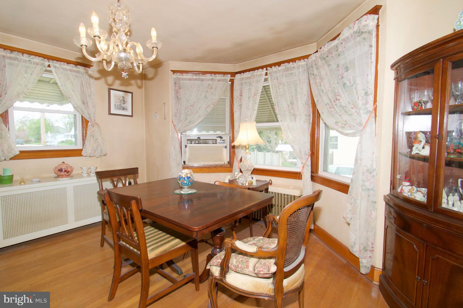 1211 Bay Ridge Avenue Annapolis, MD 21403 - Photo 13 of 30 Chandeliered Dining Room in Sunny Window Bay