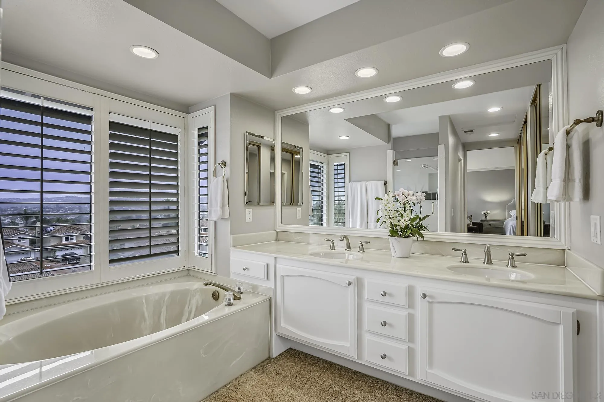 1848 Avenida Mimosa Encinitas, CA 92024 - Photo 15 of 35 a bathroom with a granite countertop sink mirror bathtub and double