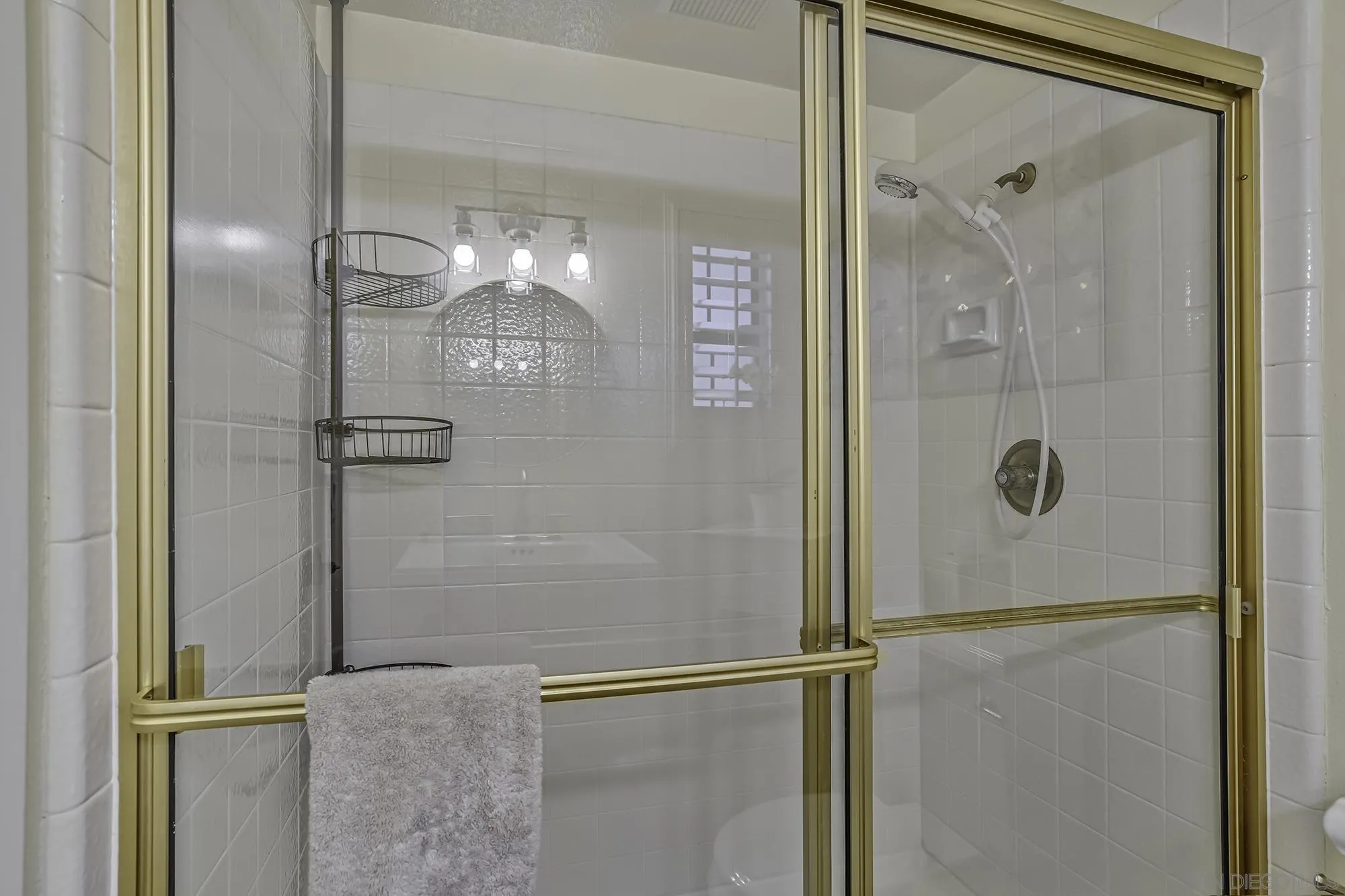 1848 Avenida Mimosa Encinitas, CA 92024 - Photo 21 of 35 a bathroom with a glass shower door