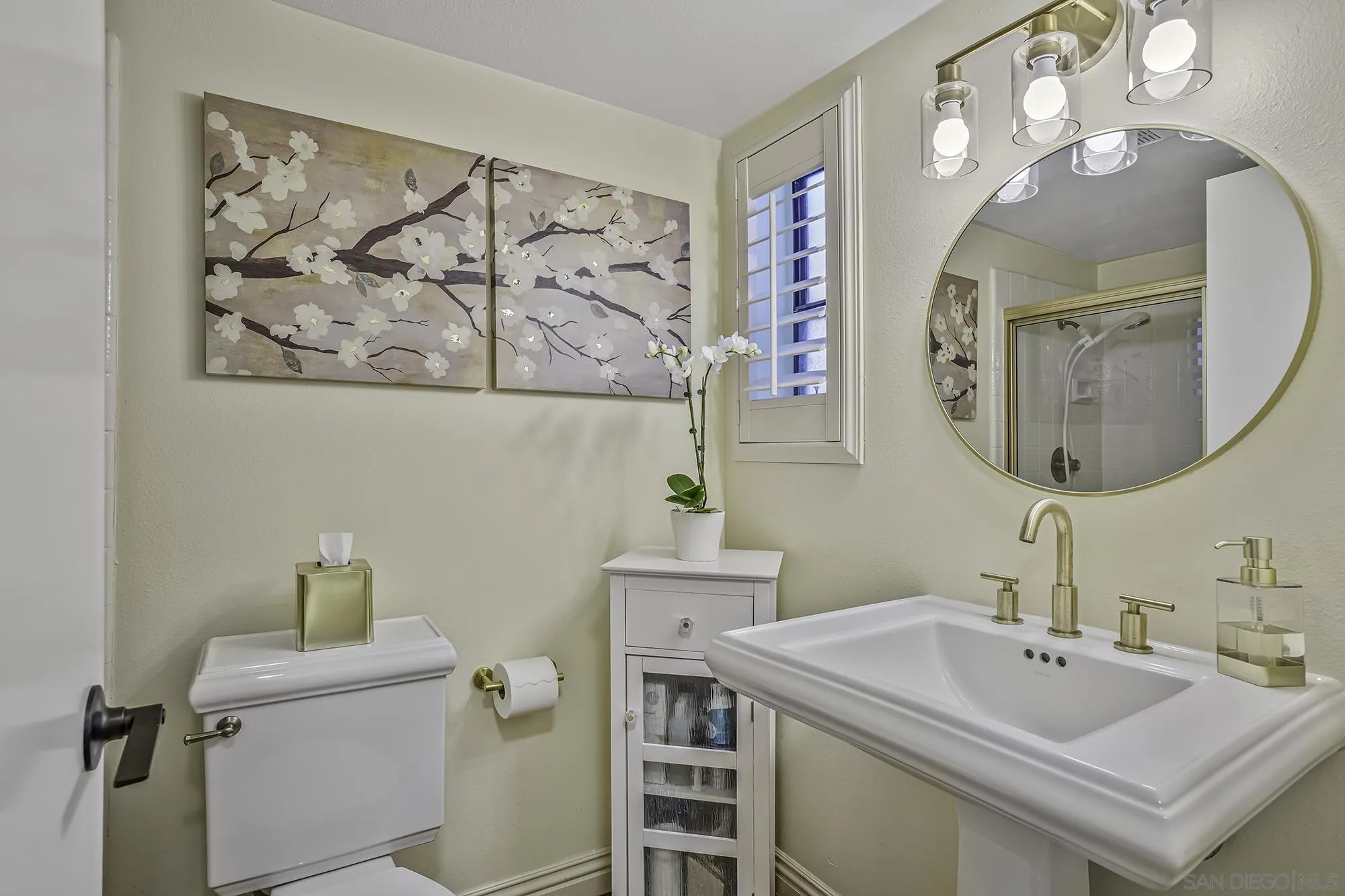 1848 Avenida Mimosa Encinitas, CA 92024 - Photo 22 of 35 a bathroom with a sink and mirror with toilet