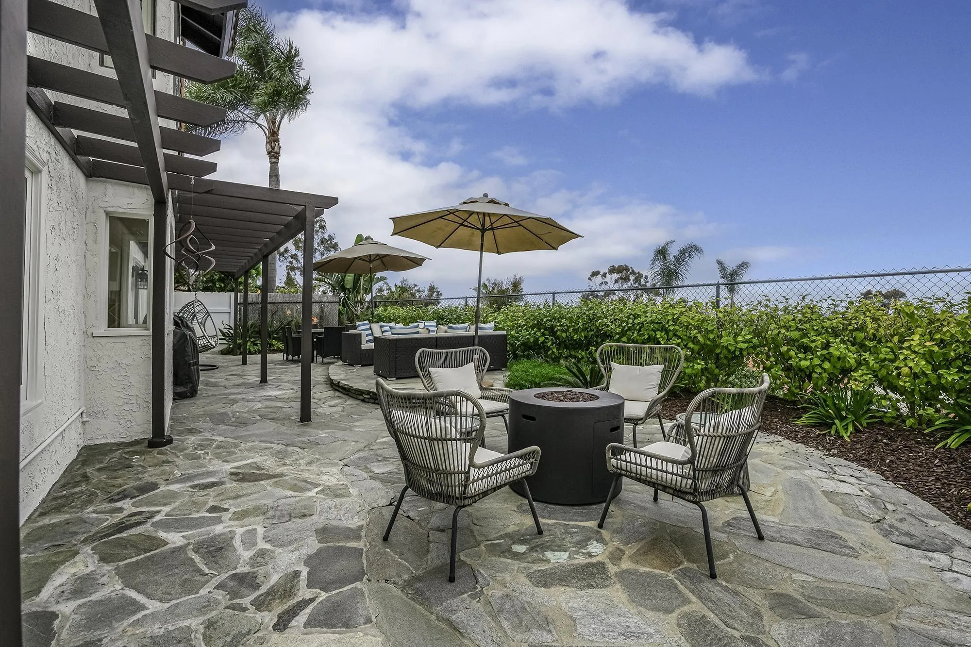1848 Avenida Mimosa Encinitas, CA 92024 - Photo 23 of 35 a patio with a patio table and chairs