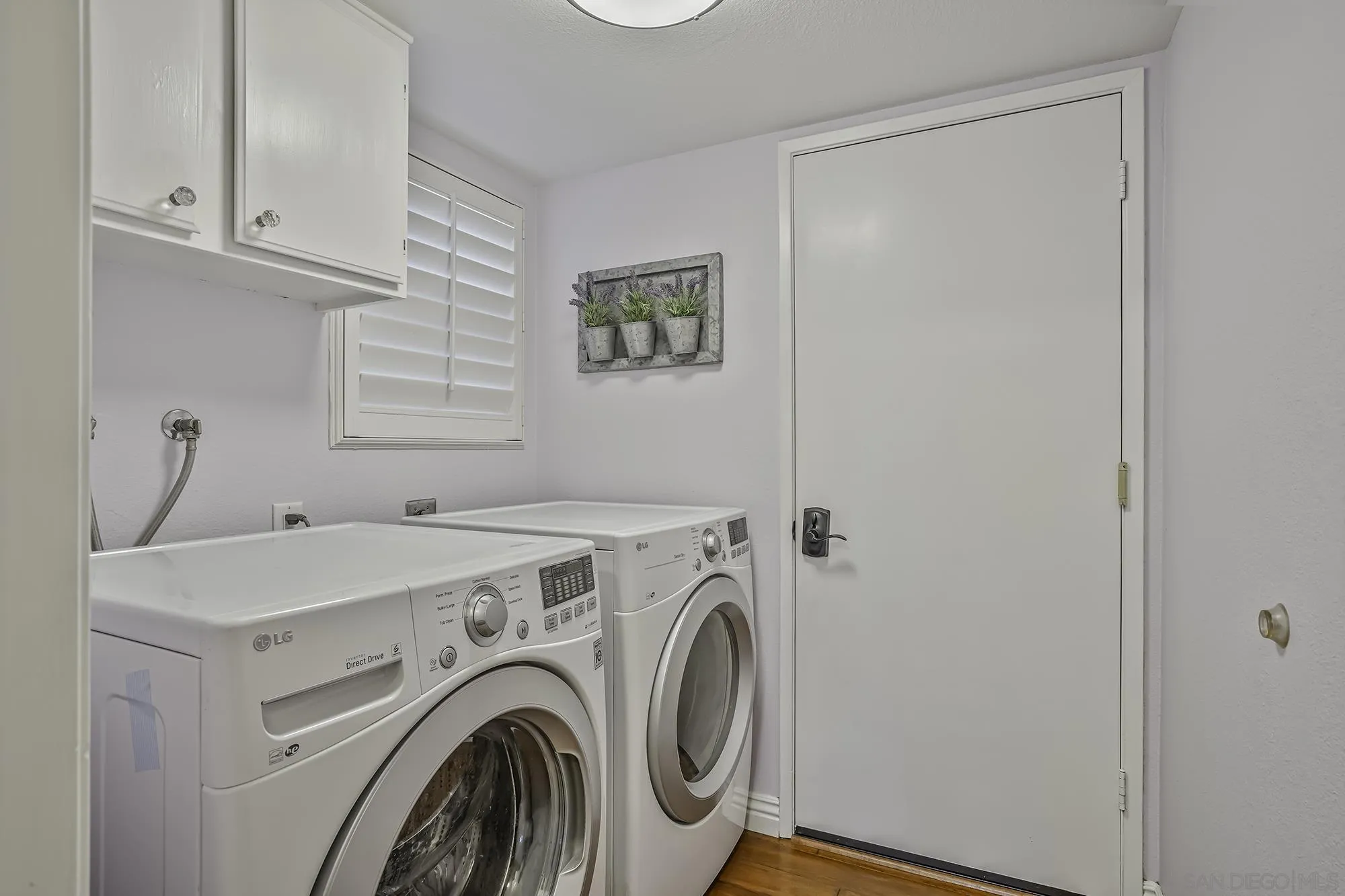 1848 Avenida Mimosa Encinitas, CA 92024 - Photo 26 of 35 a utility room with dryer and washer