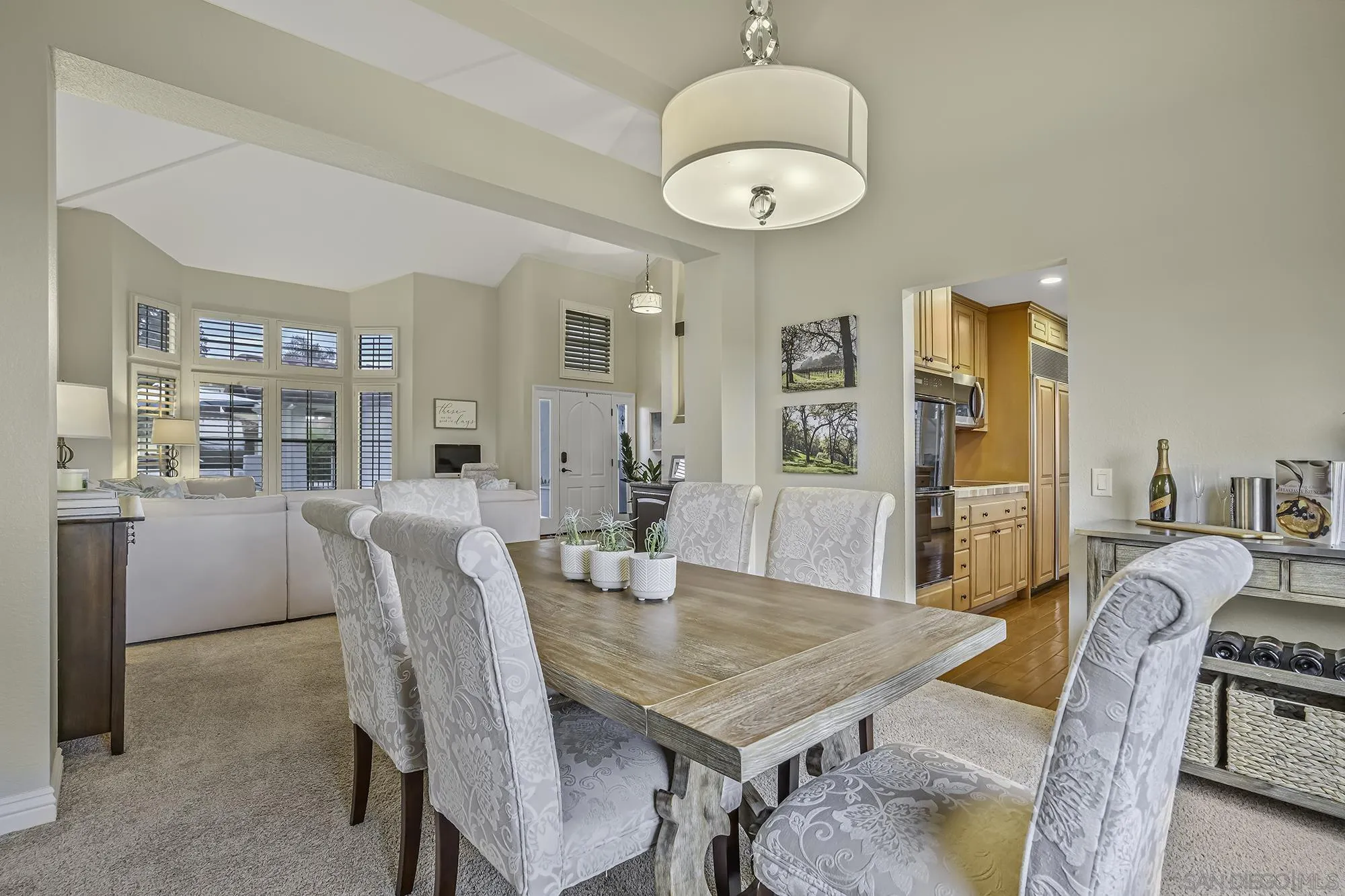 1848 Avenida Mimosa Encinitas, CA 92024 - Photo 4 of 35 a dining room with furniture a chandelier and wooden floor
