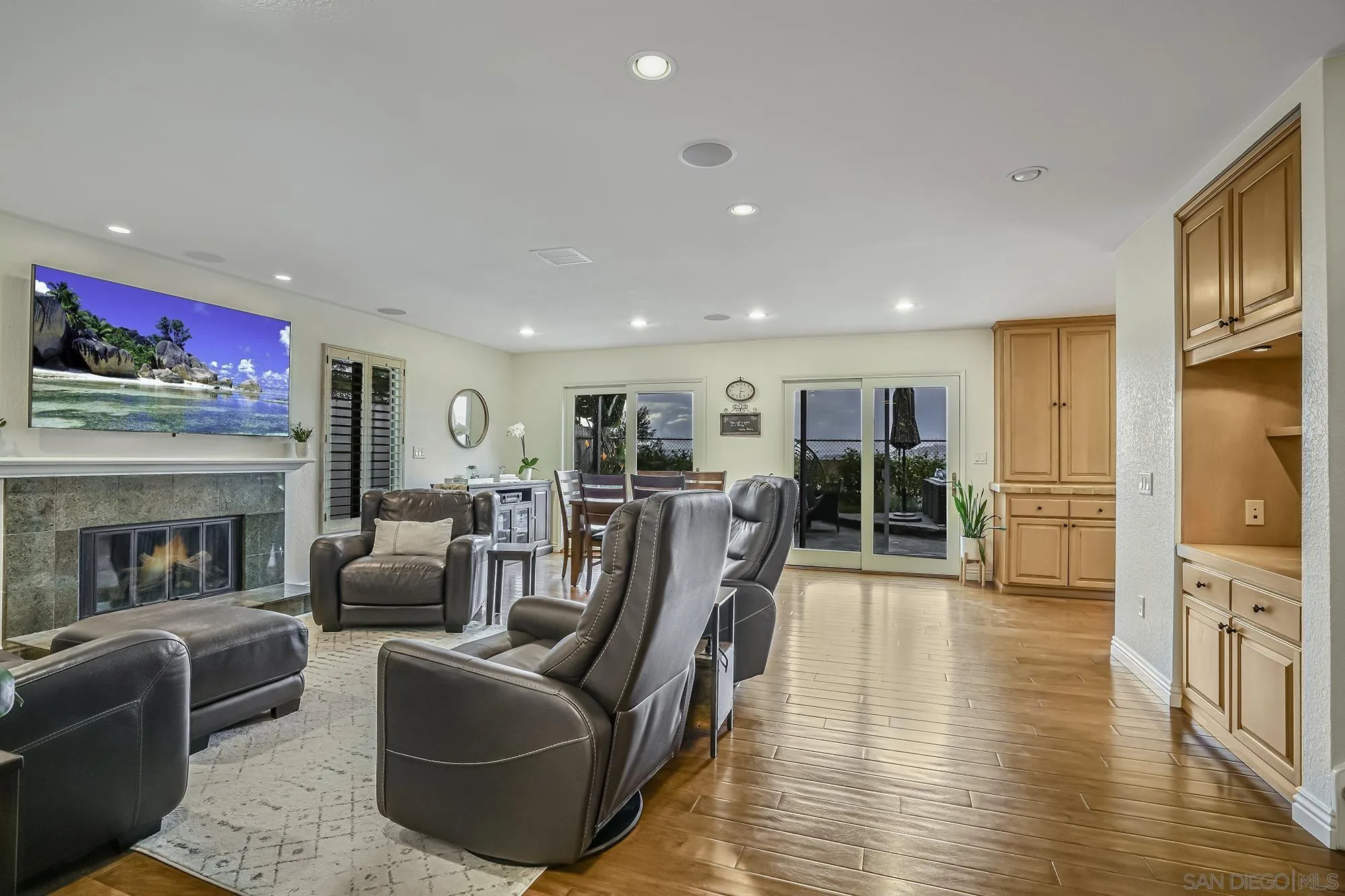 1848 Avenida Mimosa Encinitas, CA 92024 - Photo 7 of 35 a living room with furniture fireplace and flat screen tv