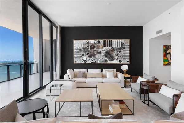 an aerial view of a house with a ocean view