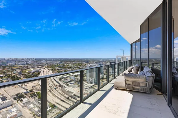a en suite bathroom with a sink and a large window