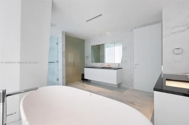 a bedroom with a bed and a stool