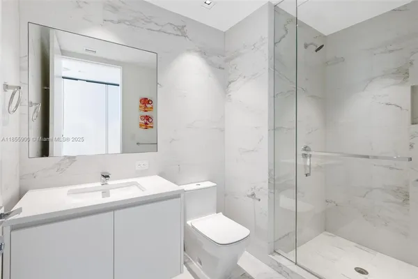 a view of a swimming pool with lawn chairs and a big yard