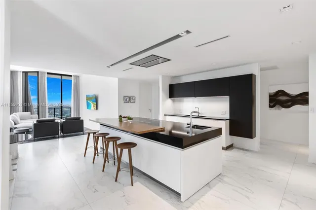 a kitchen with a stove and a refrigerator