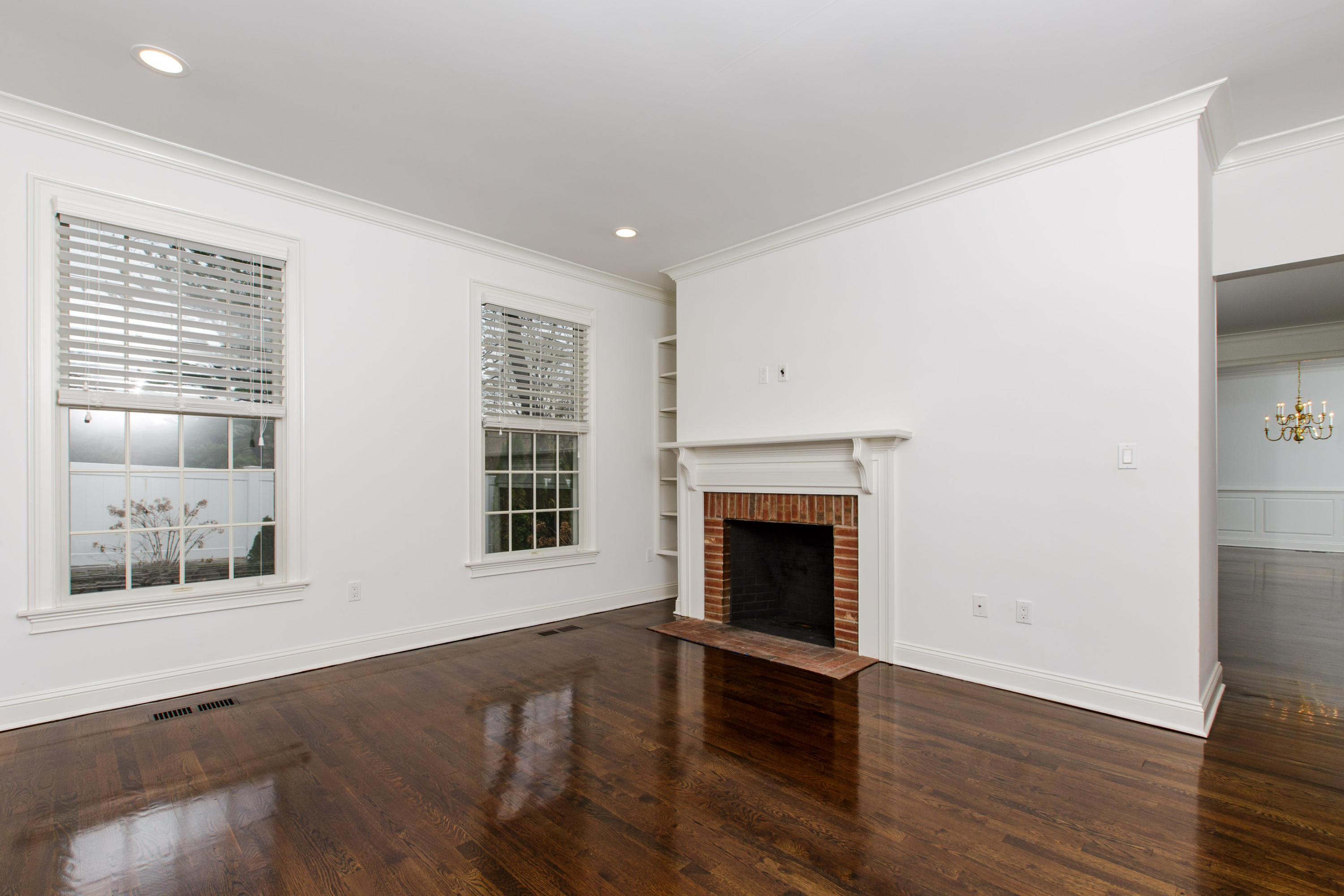 142 Harrison Avenue New Canaan, CT 06840 - Photo 15 of 30 a view of an empty room with wooden floor and a window