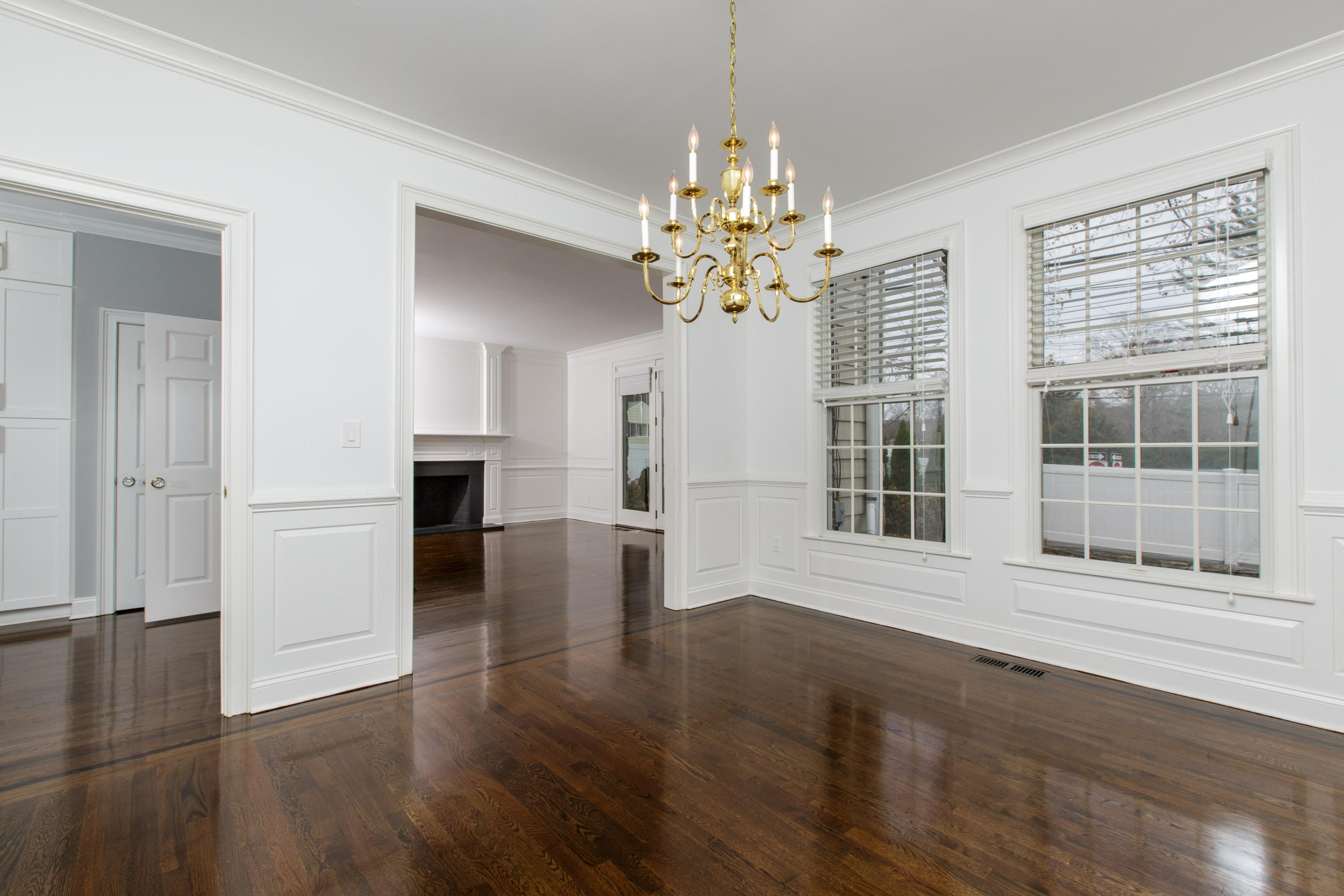 142 Harrison Avenue New Canaan, CT 06840 - Photo 17 of 30 a view of an empty room with wooden floor and a window