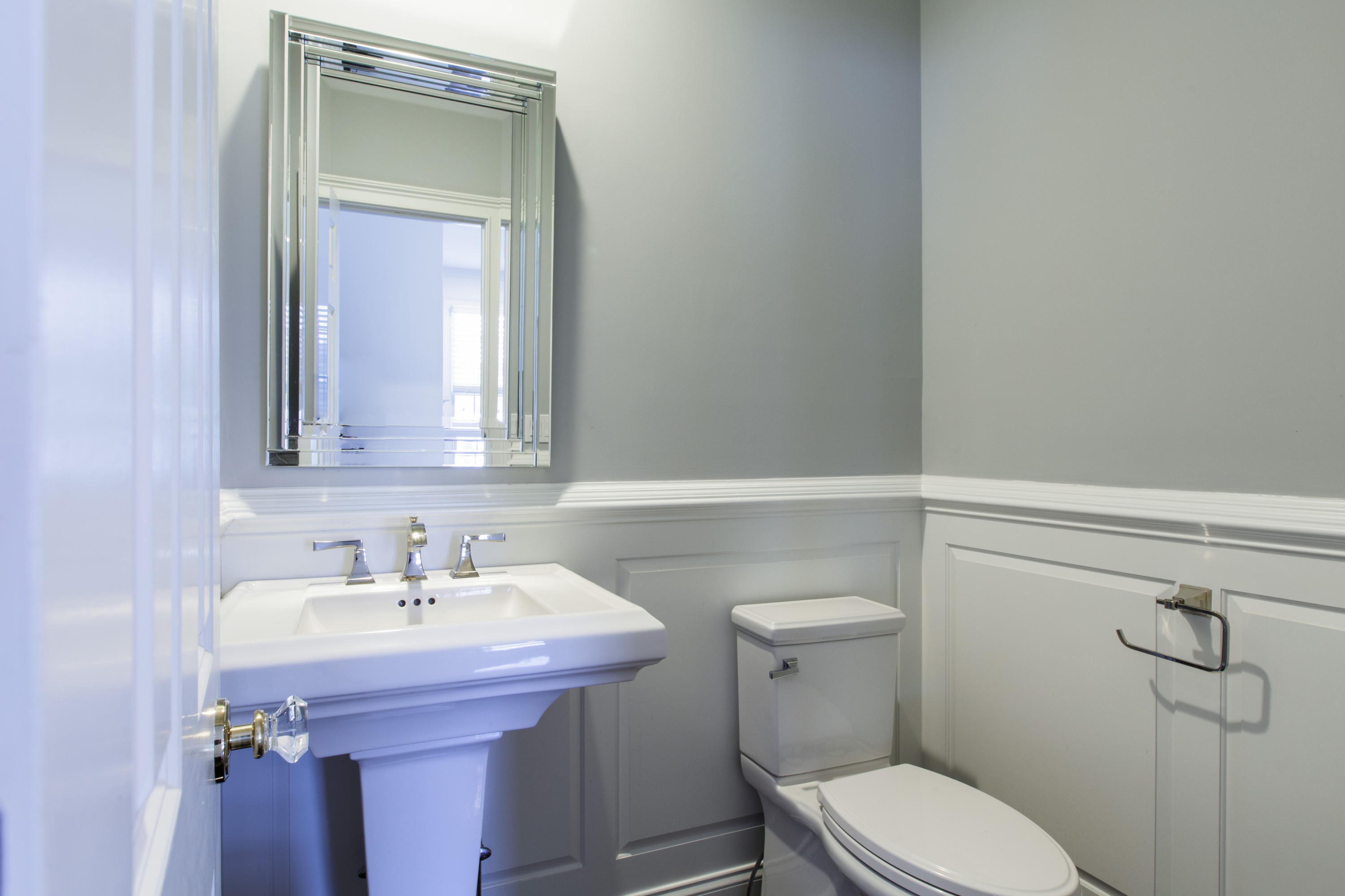 142 Harrison Avenue New Canaan, CT 06840 - Photo 20 of 30 a bathroom with a sink toilet and mirror