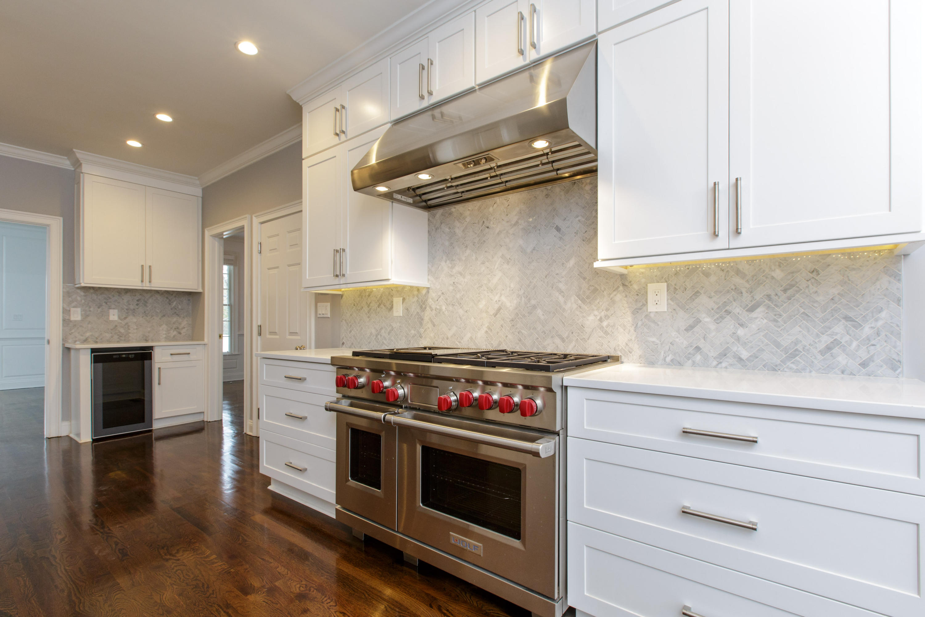 142 Harrison Avenue New Canaan, CT 06840 - Photo 7 of 30 a kitchen with stainless steel appliances granite countertop a stove and a microwave