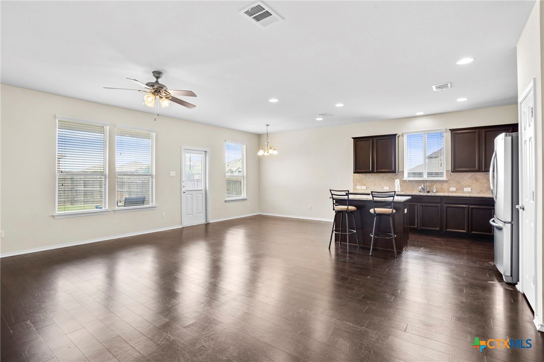 1203 Daffodil Drive Temple, TX 76502 - Photo 16 of 30 a kitchen with a table and chairs in it