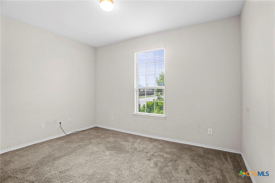 1203 Daffodil Drive Temple, TX 76502 - Photo 17 of 30 an empty room with a window