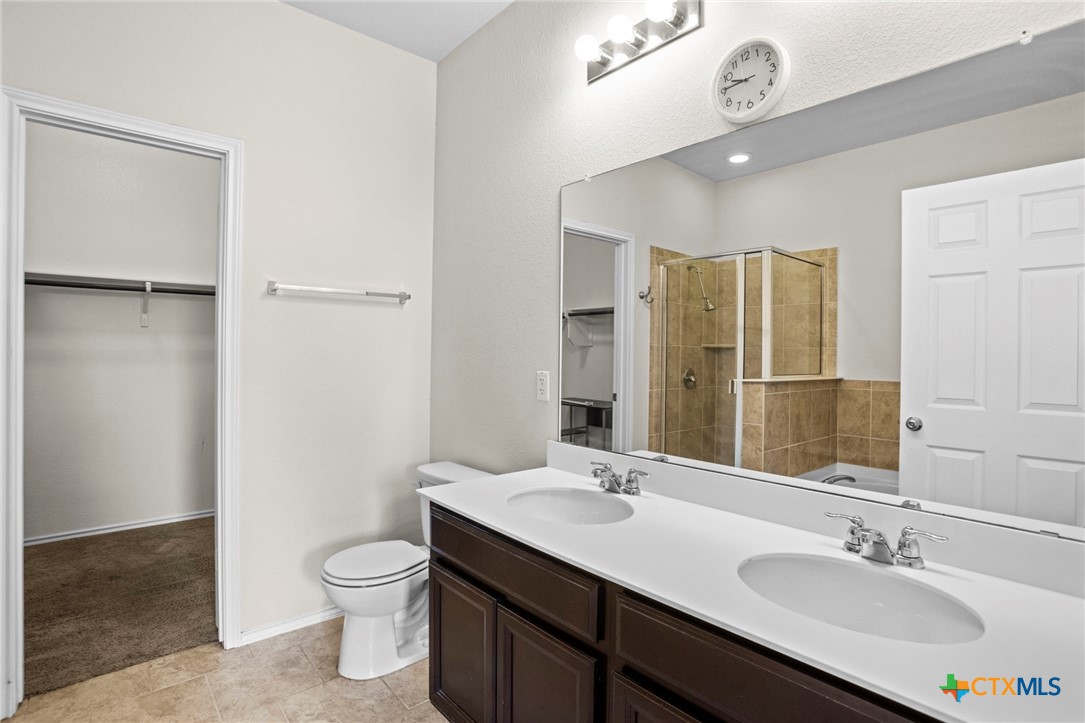 1203 Daffodil Drive Temple, TX 76502 - Photo 23 of 30 a bathroom with a sink toilet and shower